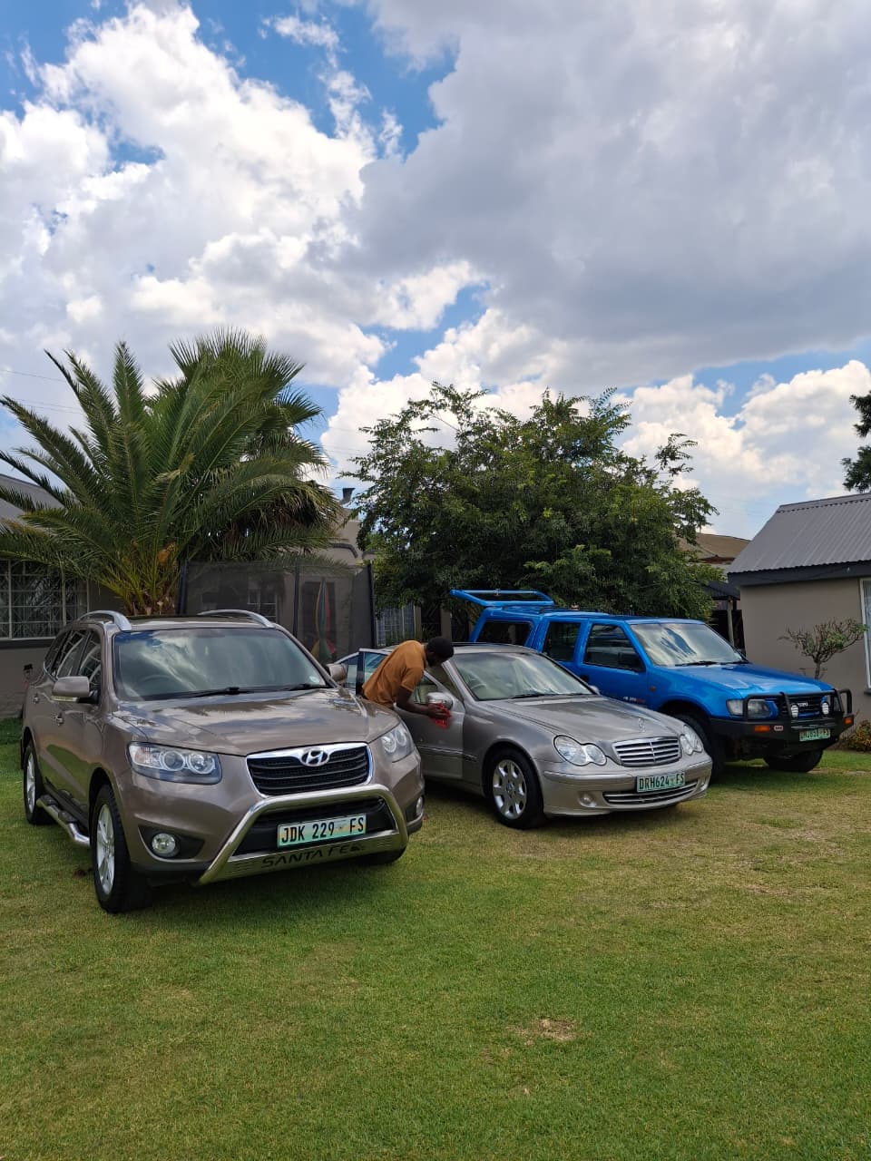 Hyundai, Mercedes and Jimny on the lawn